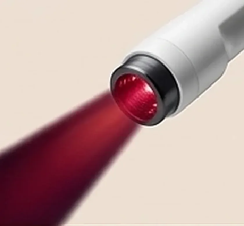 Aparelho de fototerapia emitindo luz vermelha